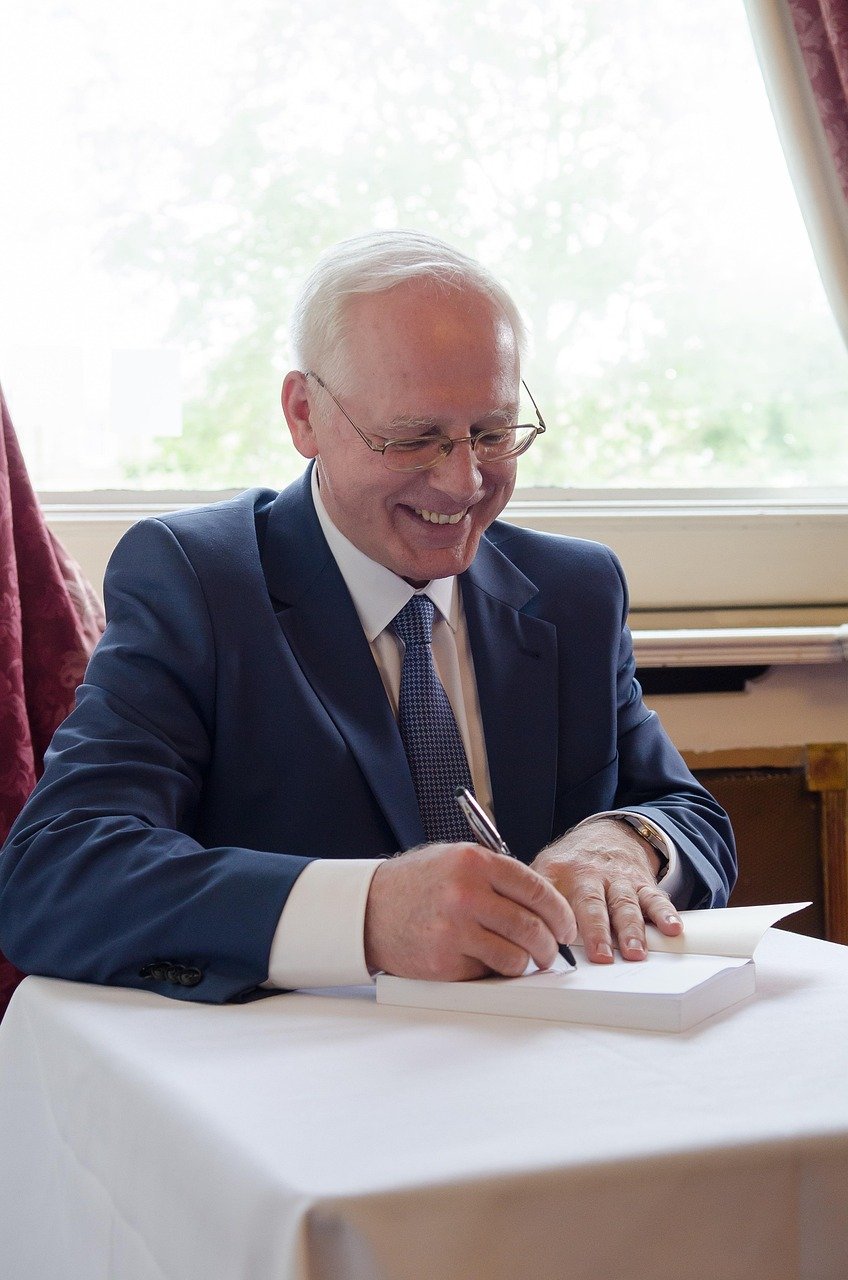 book, signing, jerzy zieba, knowledge, medicine, healing, smiling